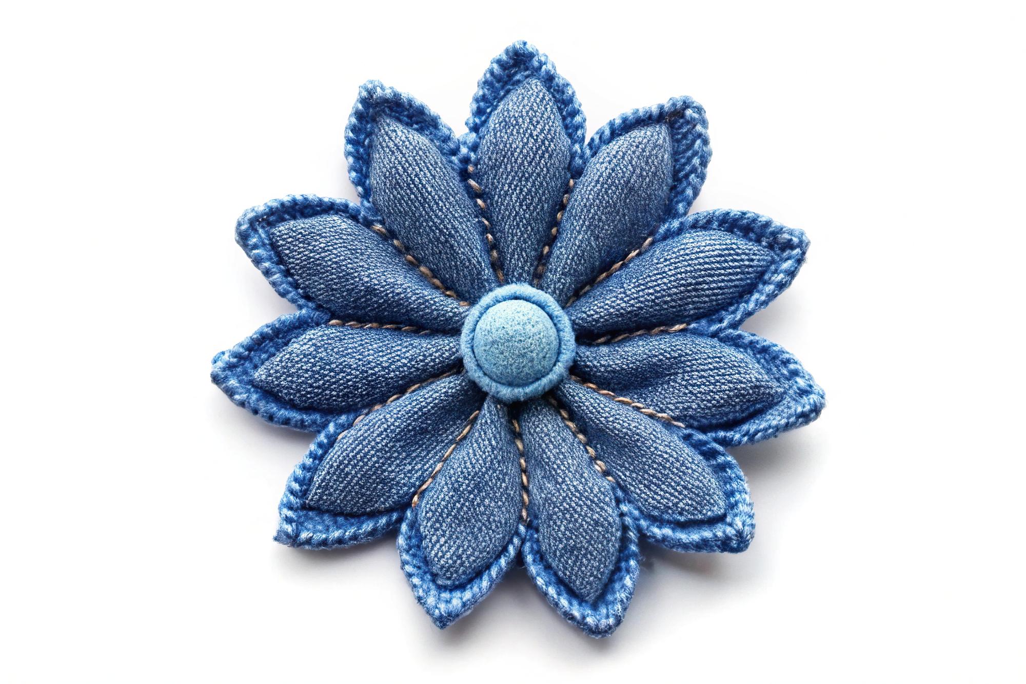 Hand-stitched floral patch on denim