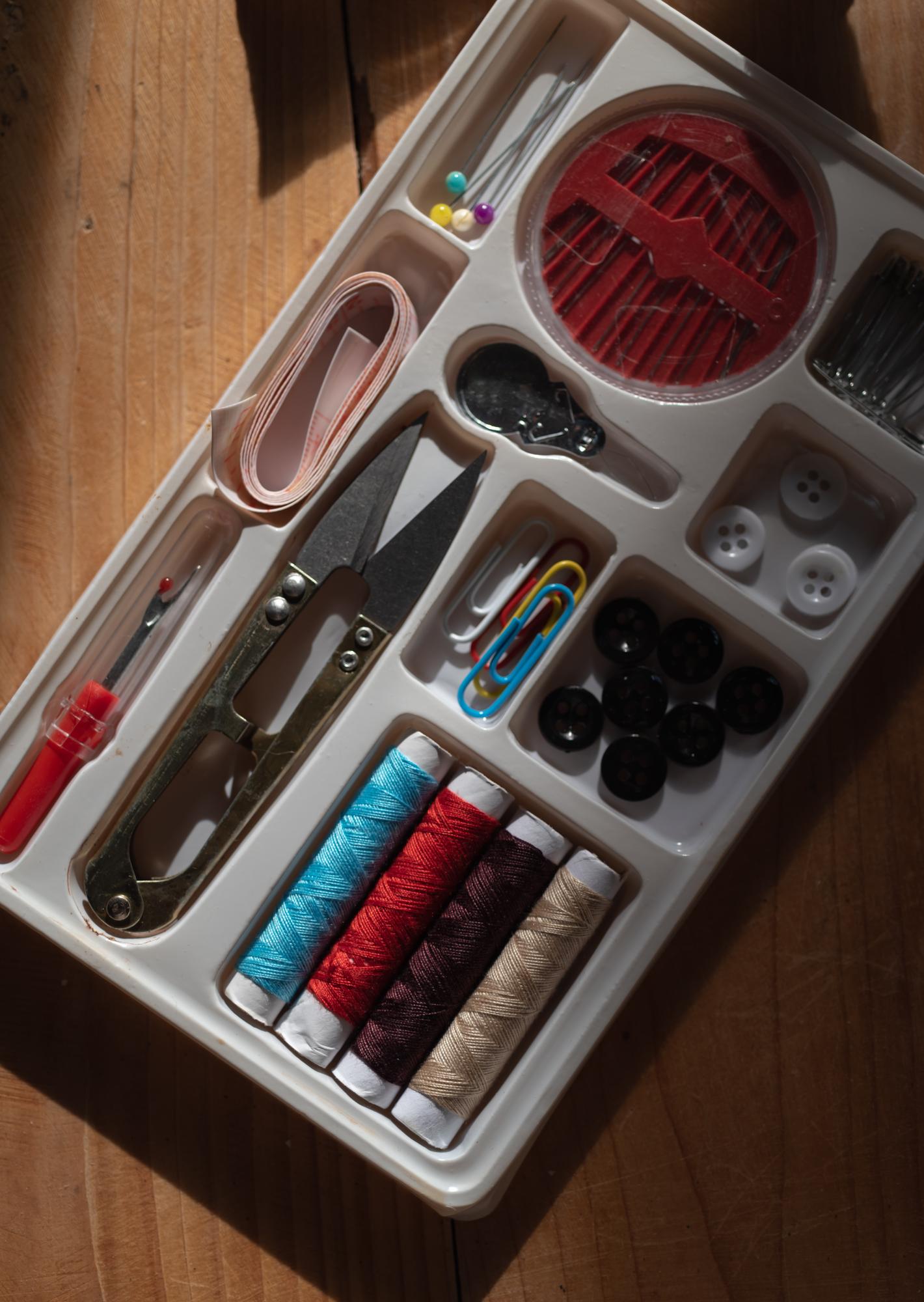 Workshop table with tools and threads